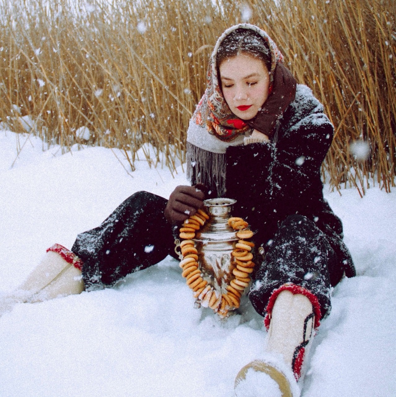 woman holding urn in snow
